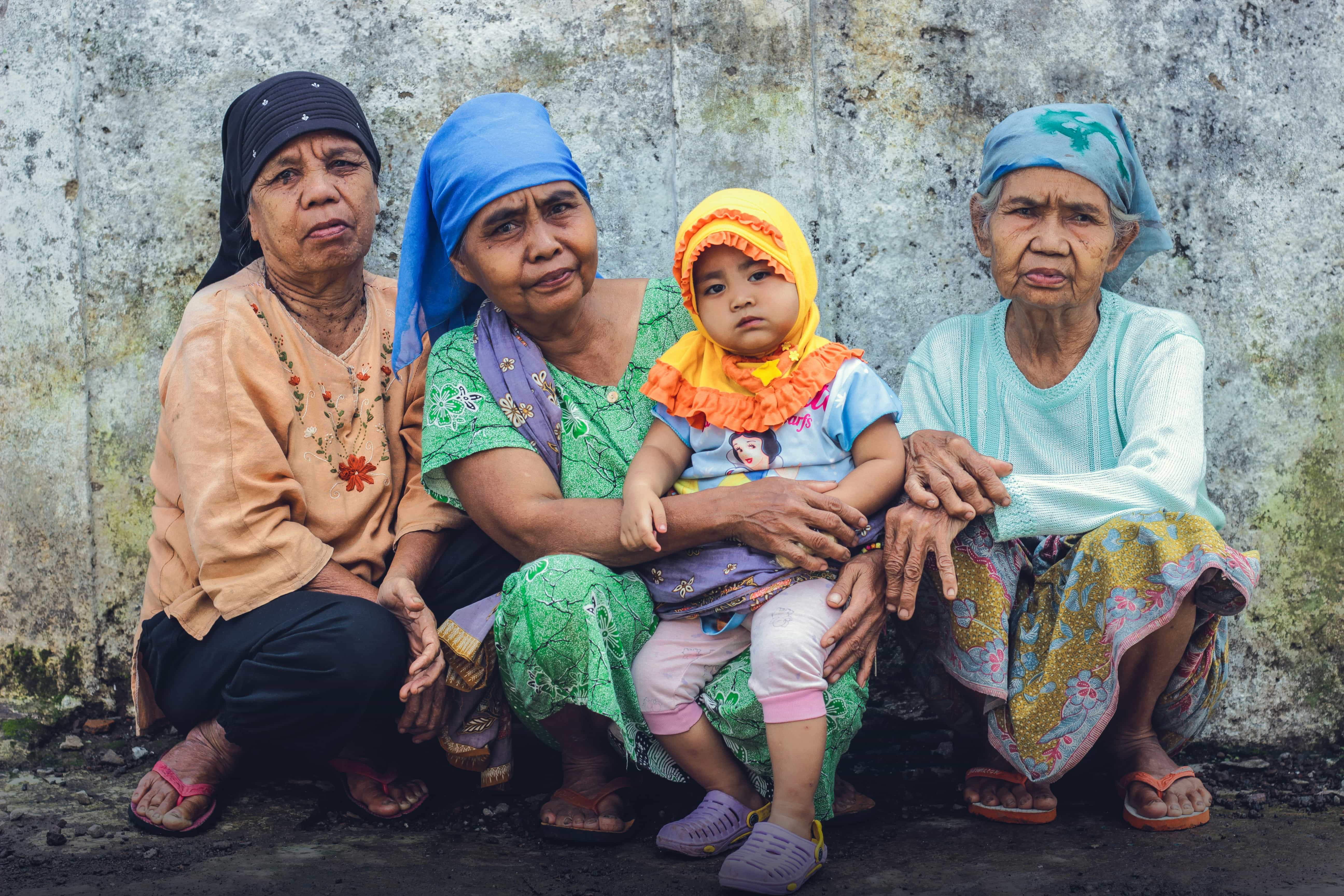 A Grandmother with Her Granddaughter and Their Neighbors