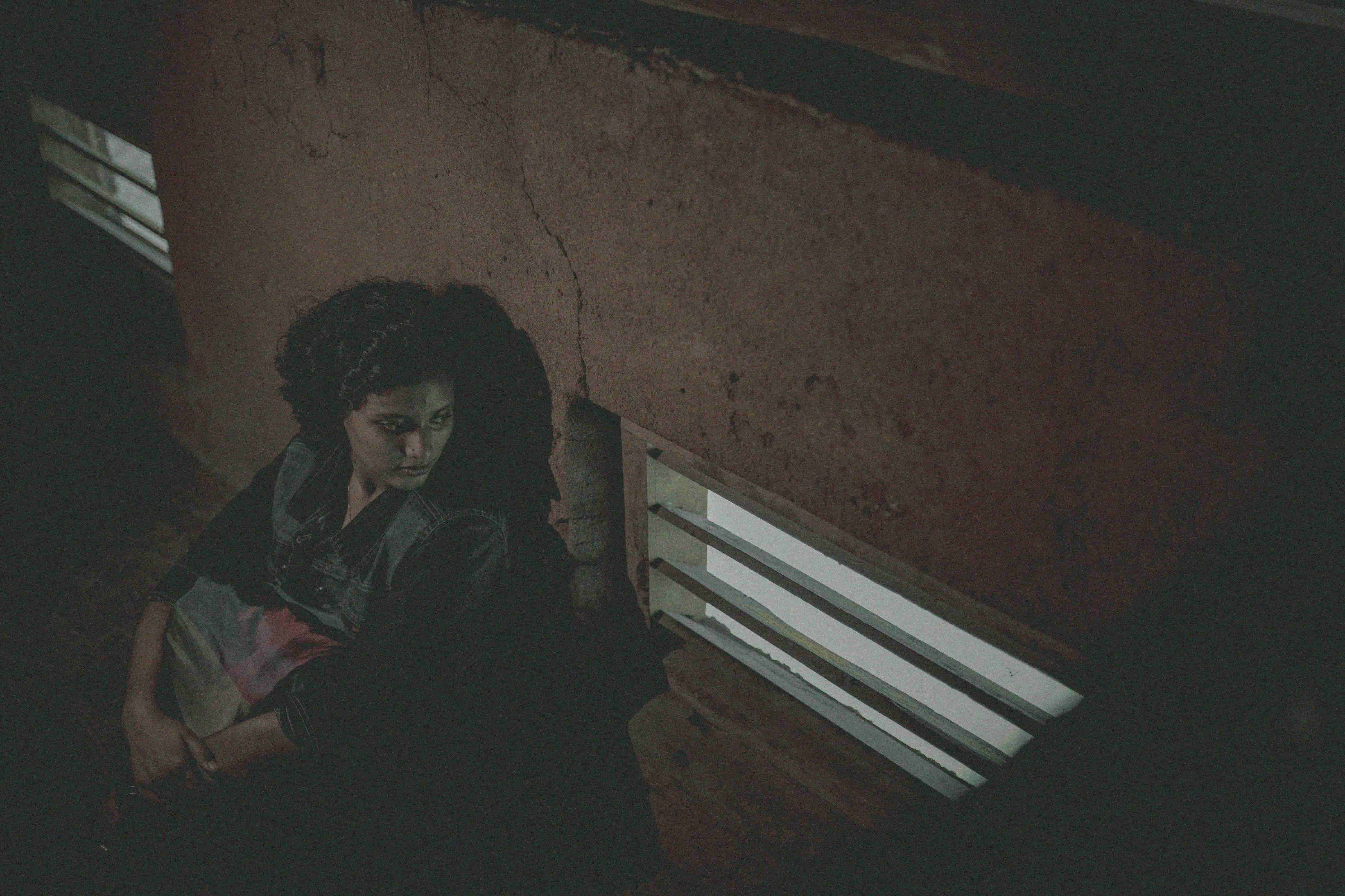 A woman sits alone after an abortion. Photo: © Unsplash